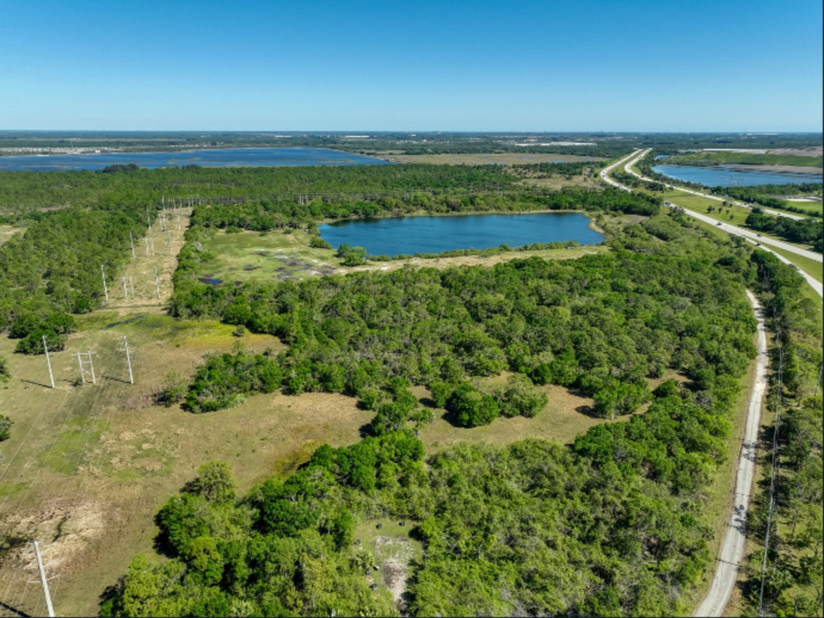 Aerial of the Project Neptune property — transmission corridor, existing lake, and the I-95 frontage